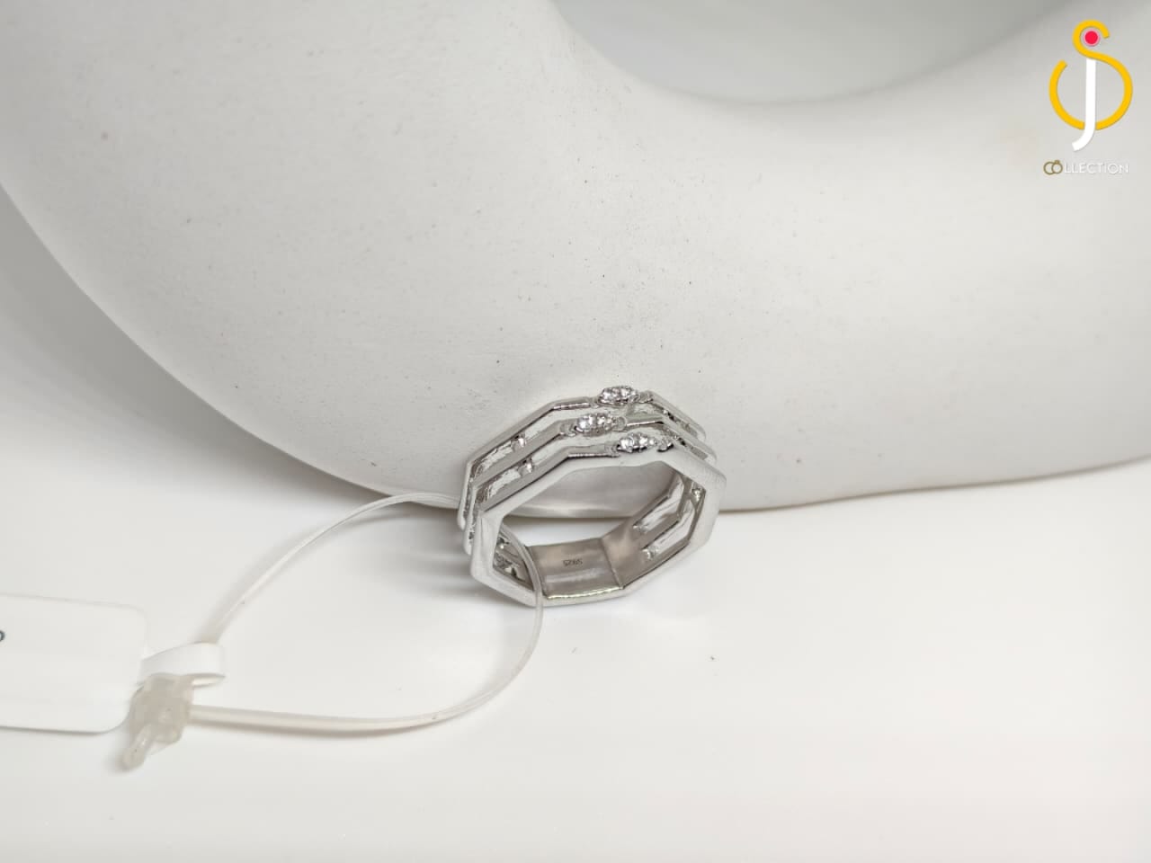 The Geometric Triple Band Ring